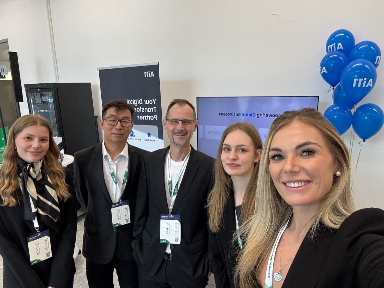 Ai11 team at conference booth