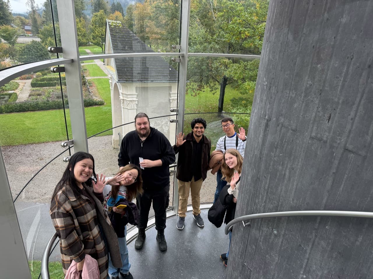 Team at glass staircase